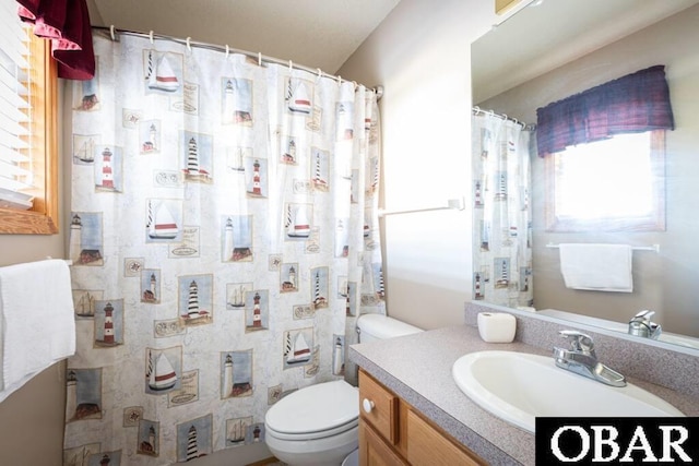 full bathroom featuring vanity and toilet