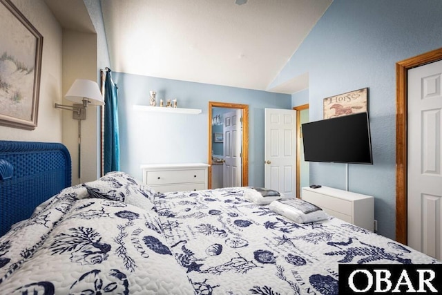 bedroom featuring lofted ceiling