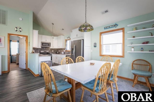 dining space with plenty of natural light, visible vents, and baseboards