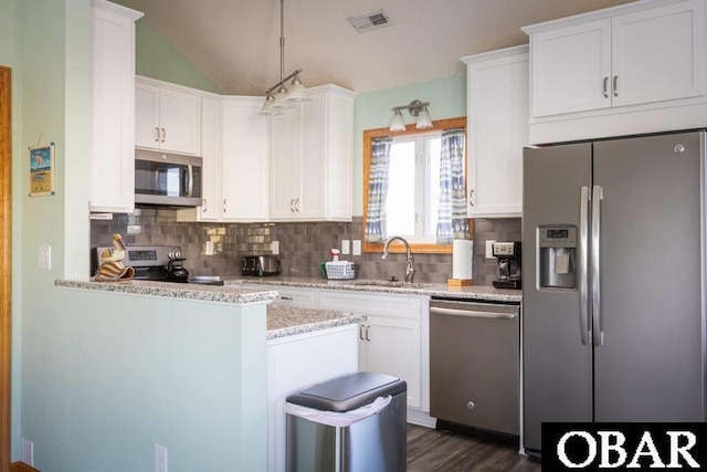 kitchen featuring white cabinetry, visible vents, appliances with stainless steel finishes, and a sink