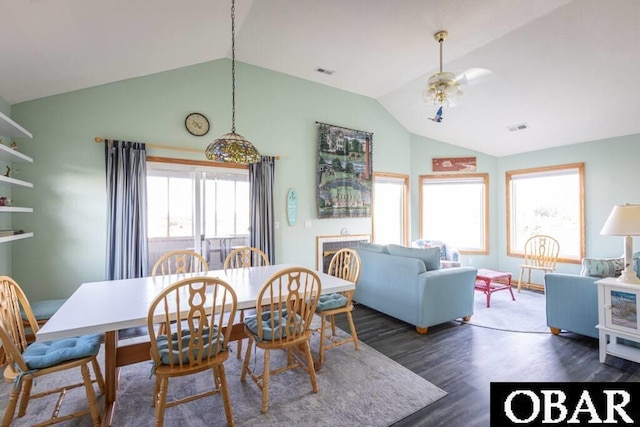 dining area with a wealth of natural light, wood finished floors, and visible vents