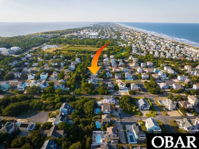 birds eye view of property featuring a water view and a residential view