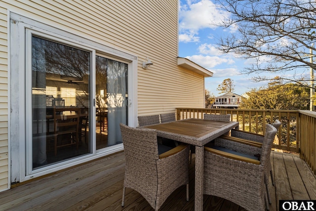 wooden deck with outdoor dining space