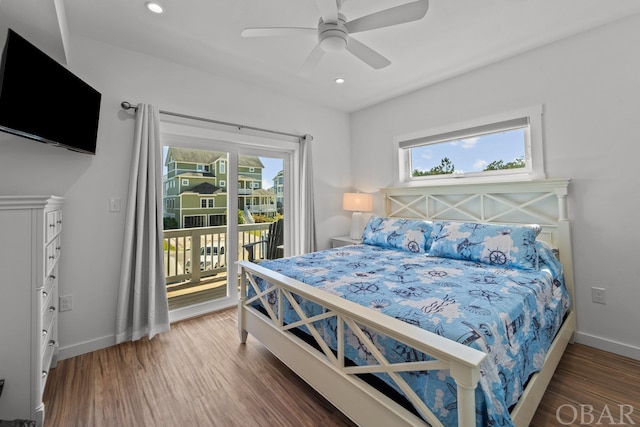 bedroom with dark wood-style floors, access to outside, baseboards, and recessed lighting