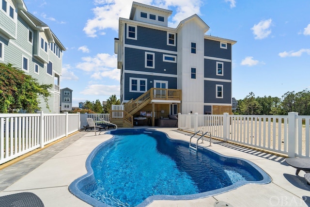 view of pool featuring a fenced in pool, stairway, a patio area, a deck, and a fenced backyard