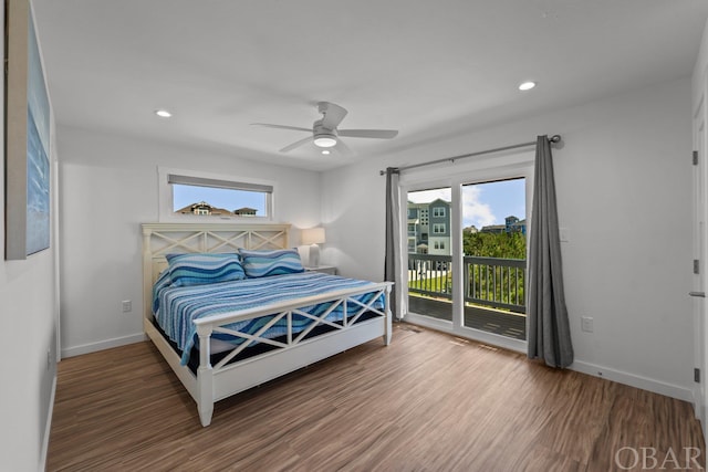 bedroom featuring access to exterior, recessed lighting, dark wood-type flooring, and baseboards