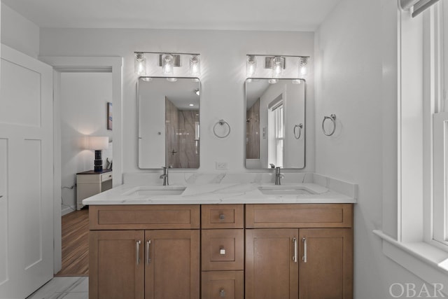 bathroom with double vanity and a sink