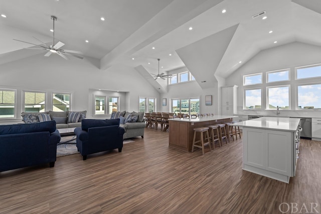 living area featuring ceiling fan, high vaulted ceiling, recessed lighting, dark wood-style flooring, and visible vents