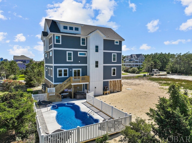 view of swimming pool with stairs, a patio area, fence, and a fenced in pool