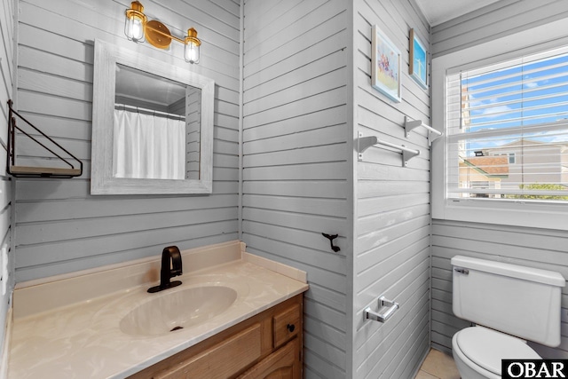1017 Corolla Dr Lot 52, Corolla, NC 27927 - bathroom featuring wood walls, toilet, and vanity