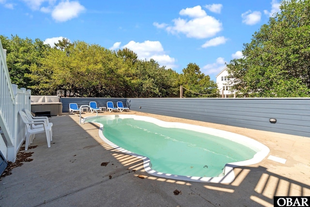 1017 Corolla Dr Lot 52, Corolla, NC 27927 - view of swimming pool featuring a patio, a fenced backyard, and view of scattered trees