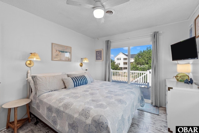 1017 Corolla Dr Lot 52, Corolla, NC 27927 - bedroom with access to outside, a textured ceiling, wood finished floors, and a ceiling fan