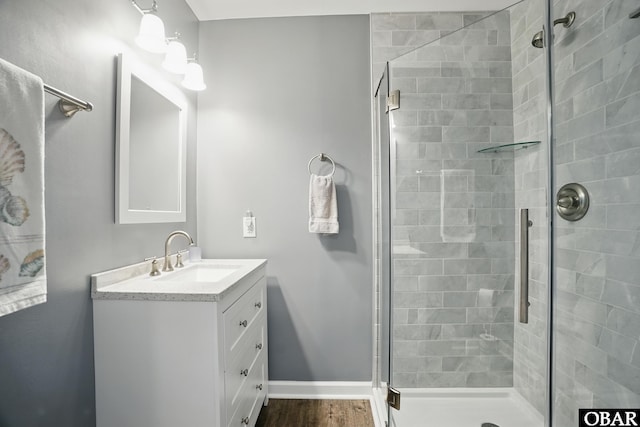 184 Tabernacle Ln, Aydlett, NC 27916 - full bathroom with a stall shower, vanity, and wood finished floors