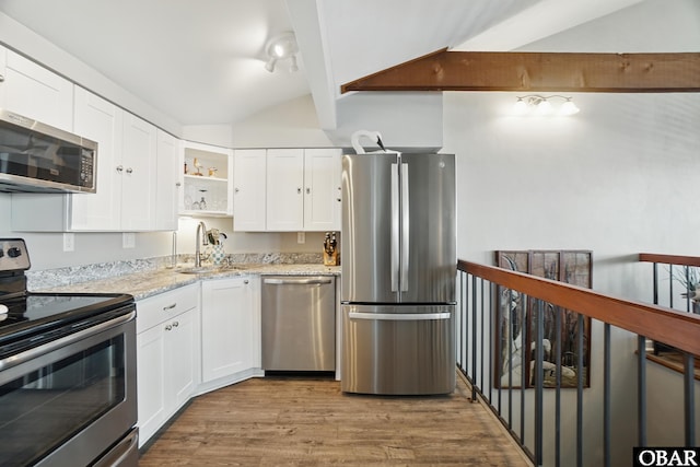 184 Tabernacle Ln, Aydlett, NC 27916 - kitchen featuring stainless steel appliances, open shelves, light wood-style flooring, and white cabinets