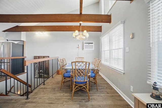 184 Tabernacle Ln, Aydlett, NC 27916 - dining room featuring a chandelier, wood finished floors, and an AC wall unit