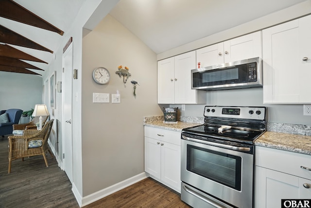 184 Tabernacle Ln, Aydlett, NC 27916 - kitchen featuring stainless steel appliances, dark wood finished floors, white cabinetry, vaulted ceiling, and light stone countertops
