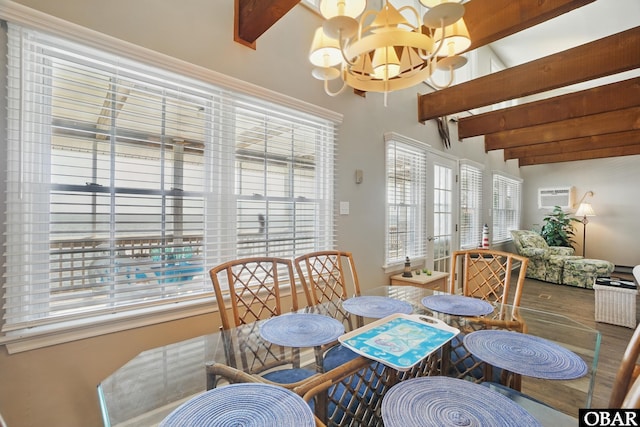 184 Tabernacle Ln, Aydlett, NC 27916 - dining area with a chandelier, wood finished floors, and a wall mounted air conditioner