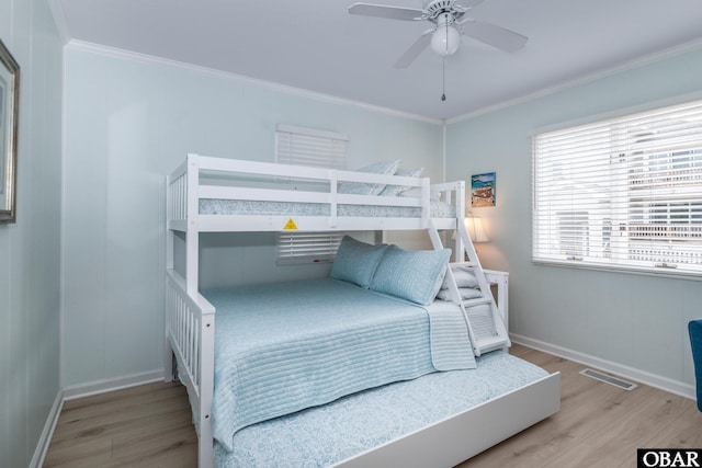 630 Skimmer Ct Lot 20, Corolla, NC 27927 - bedroom with wood finished floors, crown molding, baseboards, and ceiling fan