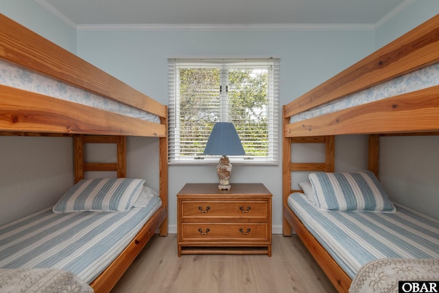 630 Skimmer Ct Lot 20, Corolla, NC 27927 - bedroom with light wood-style flooring and crown molding