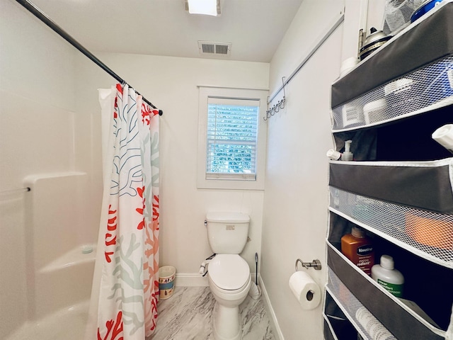 bathroom featuring curtained shower, toilet, visible vents, baseboards, and marble finish floor