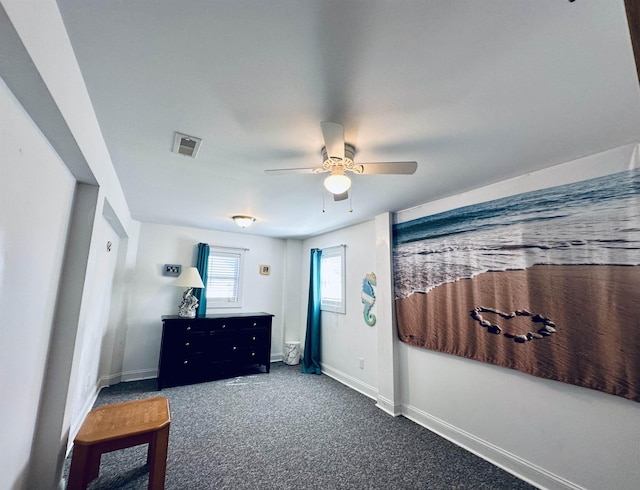 bedroom with a ceiling fan, carpet flooring, visible vents, and baseboards