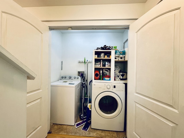 laundry area with laundry area and washer and clothes dryer