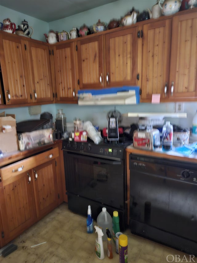 kitchen with black appliances and brown cabinets