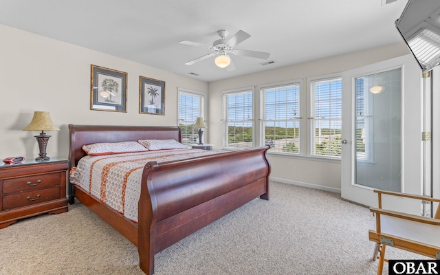 carpeted bedroom with baseboards and ceiling fan