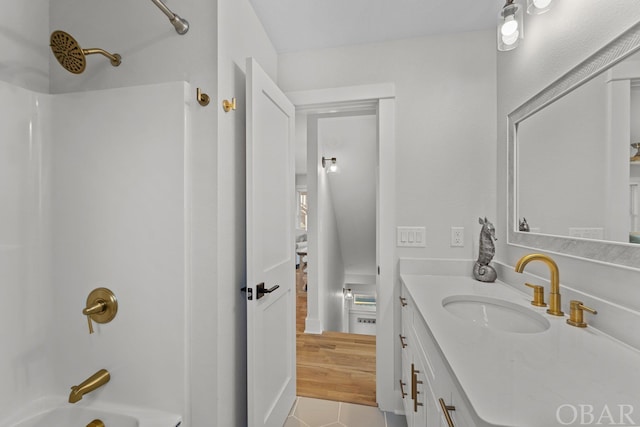 full bath featuring tub / shower combination and vanity