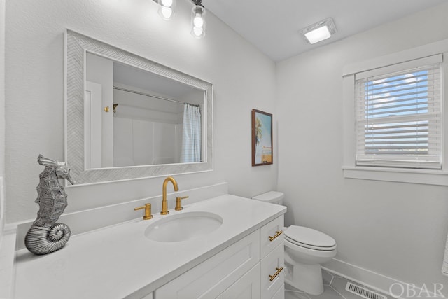 bathroom featuring curtained shower, visible vents, toilet, vanity, and tile patterned flooring