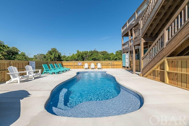 view of swimming pool with fence private yard, a fenced in pool, and a patio