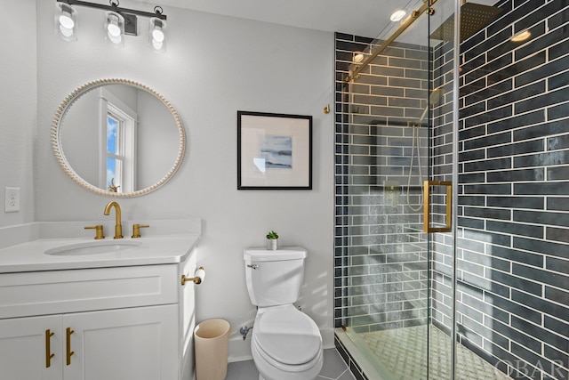 full bath featuring a stall shower, vanity, and toilet