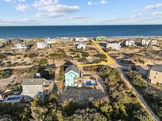 bird's eye view with a residential view and a water view