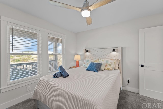 bedroom with carpet, a ceiling fan, and baseboards