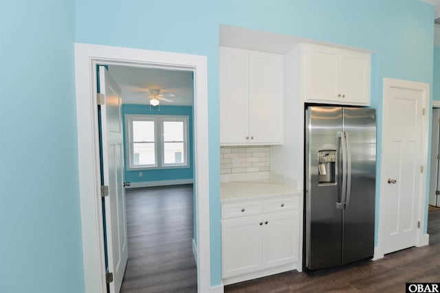 kitchen featuring white cabinetry, stainless steel fridge, and dark wood-style floors