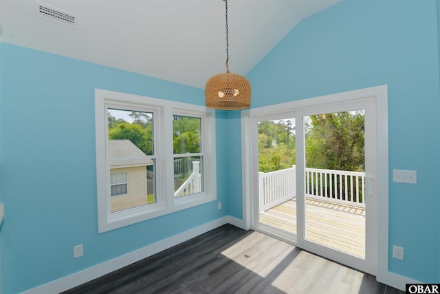 interior space with visible vents, baseboards, high vaulted ceiling, and dark wood finished floors
