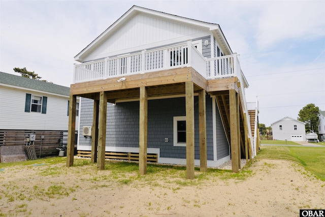 back of house with stairway and a deck