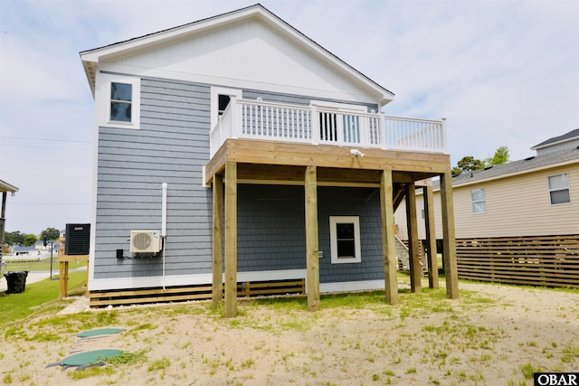 back of property featuring ac unit and a wooden deck