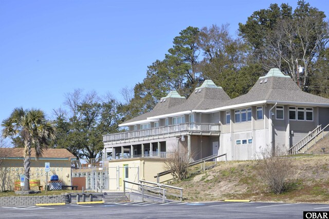 view of front of property with a shingled roof