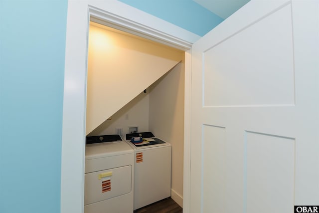 clothes washing area with independent washer and dryer, laundry area, and dark wood-style floors