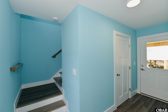interior space with wood finished floors and baseboards