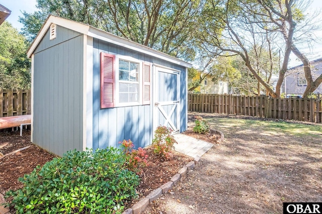 view of shed with a fenced backyard