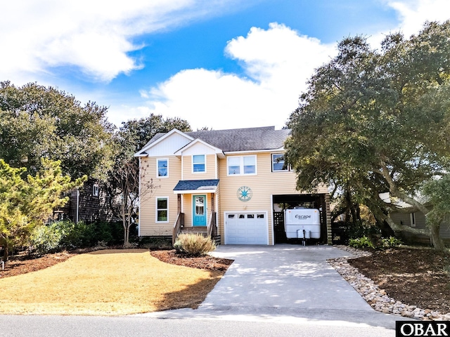 view of front facade with a garage and concrete driveway