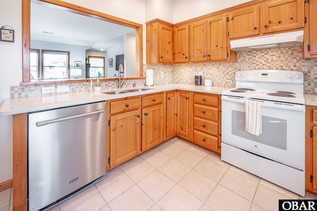 kitchen featuring white electric stove, under cabinet range hood, a sink, light countertops, and dishwasher