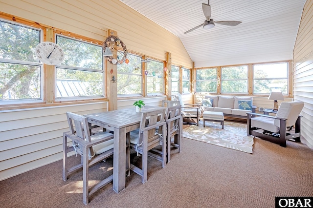 sunroom / solarium featuring lofted ceiling and a ceiling fan