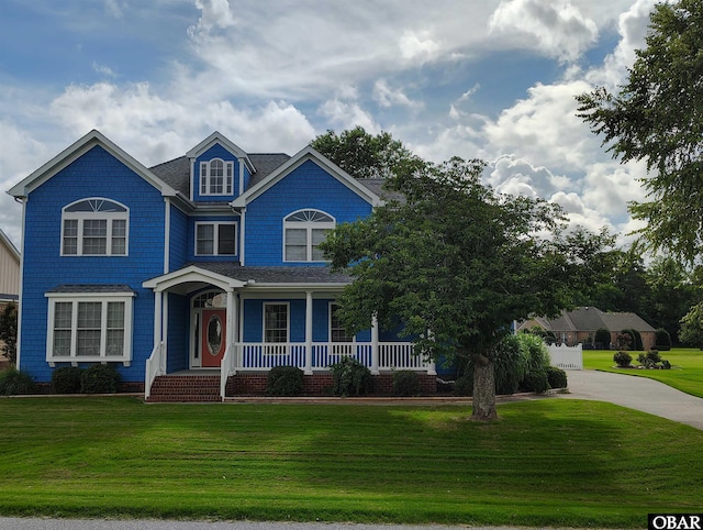 121 Bayside Dr Lot # 71, Moyock, NC 27958 - view of front of property featuring a porch, a front lawn, concrete driveway, and a shingled roof