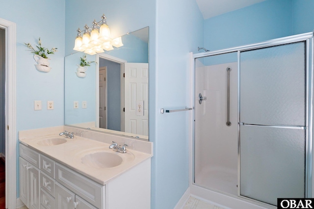 121 Bayside Dr Lot # 71, Moyock, NC 27958 - bathroom with a shower stall and double vanity
