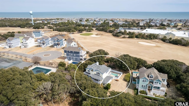 drone / aerial view with a residential view and a water view