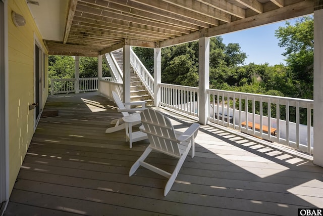 wooden deck featuring stairs