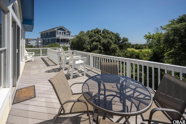 deck featuring outdoor dining area